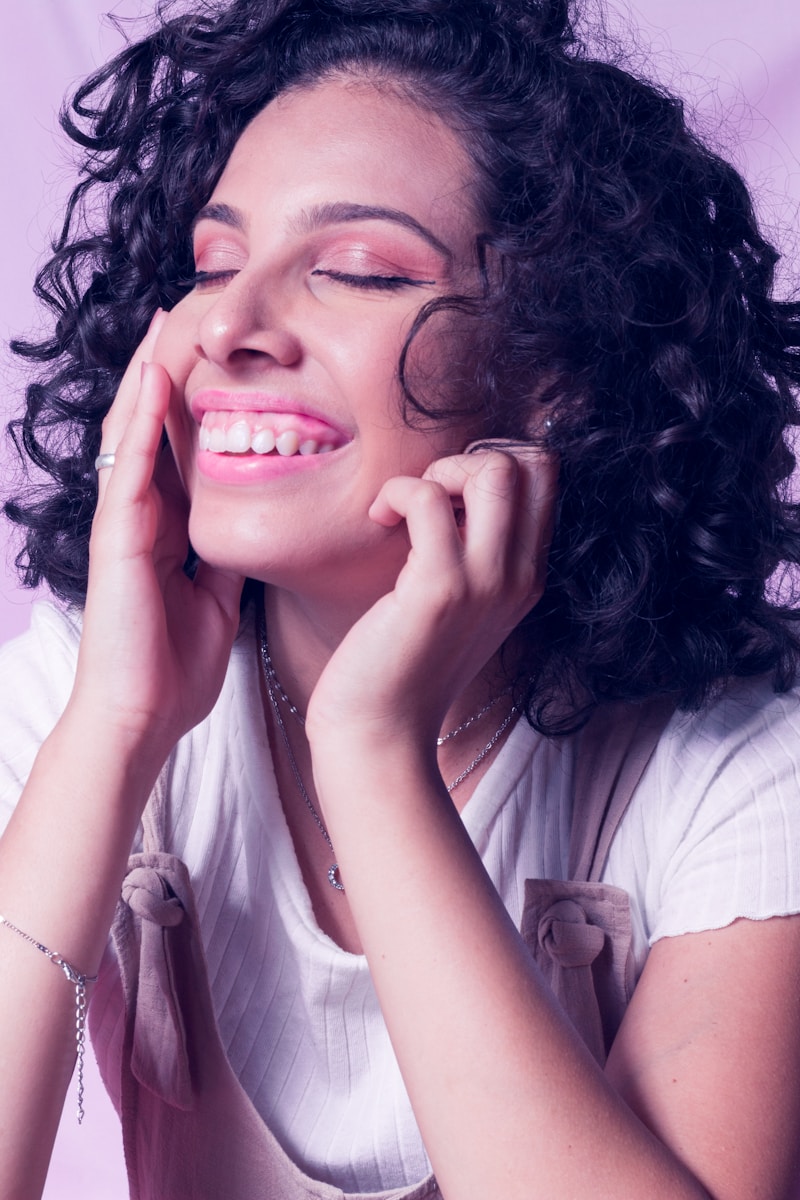 a close up of a person with curly hair